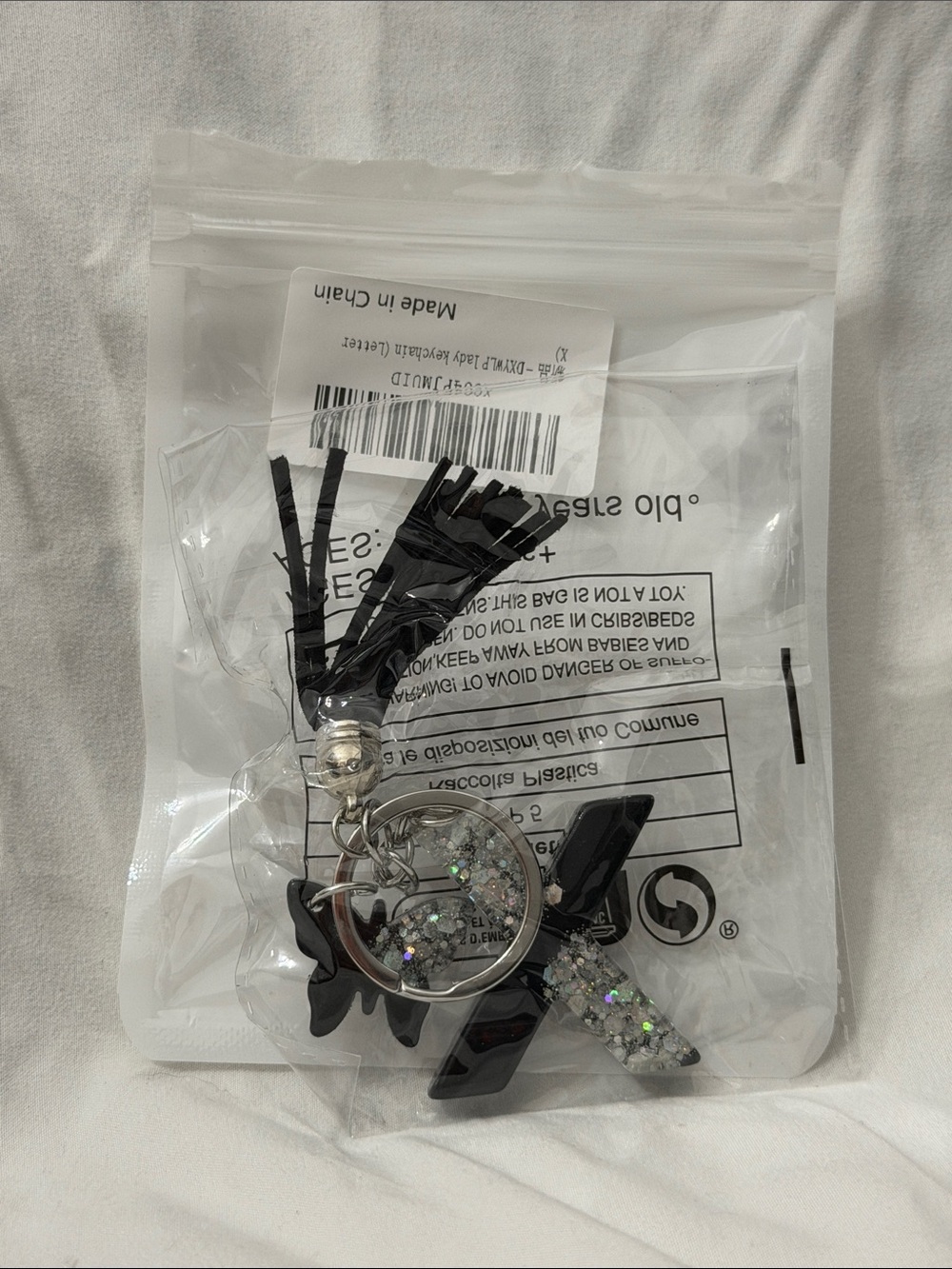 “X” Black Tassel Keychain with butterfly